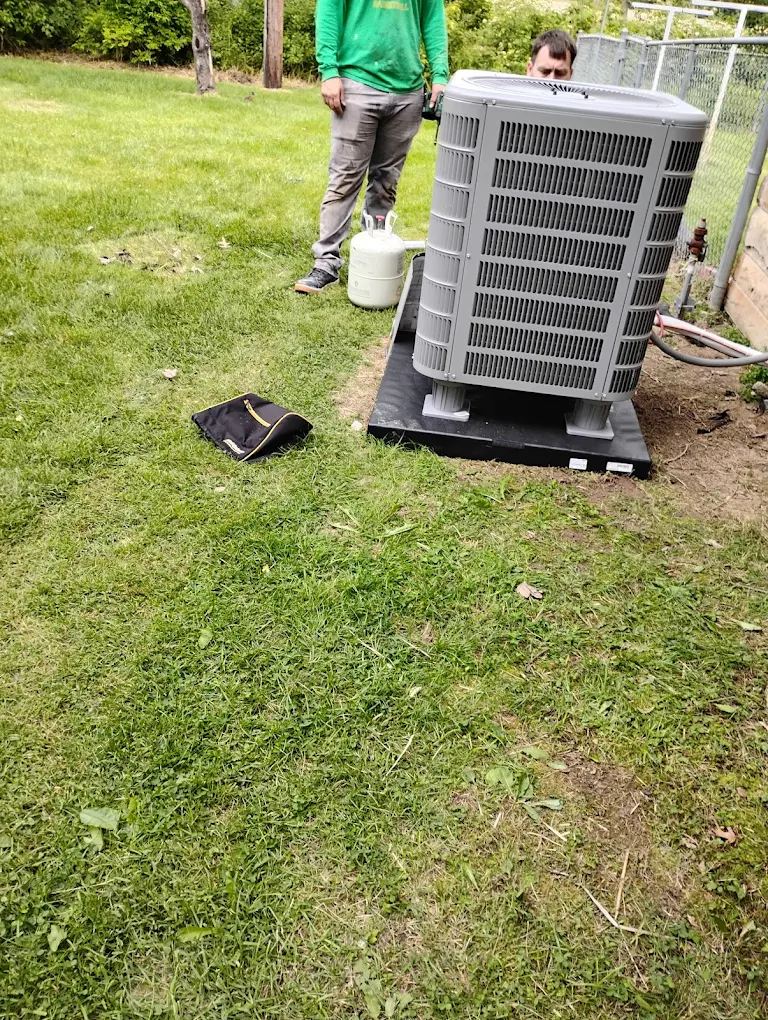 JHC Services crew setting a new condenser on install day